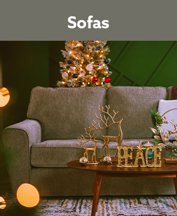 Grey Sofa with a Christmas Tree In The Background