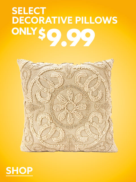A decorative tan pillow on a yellow backdrop.
