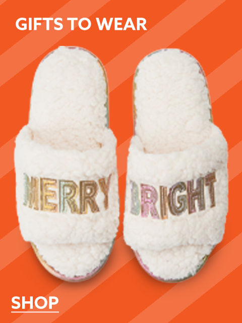 Cozy Slippers that say 'Merry' and 'Bright'.