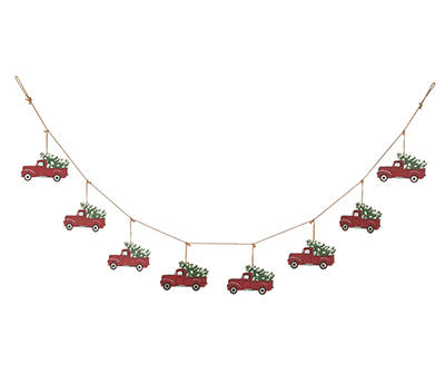 Red Metal Truck Carrying Tree Garland