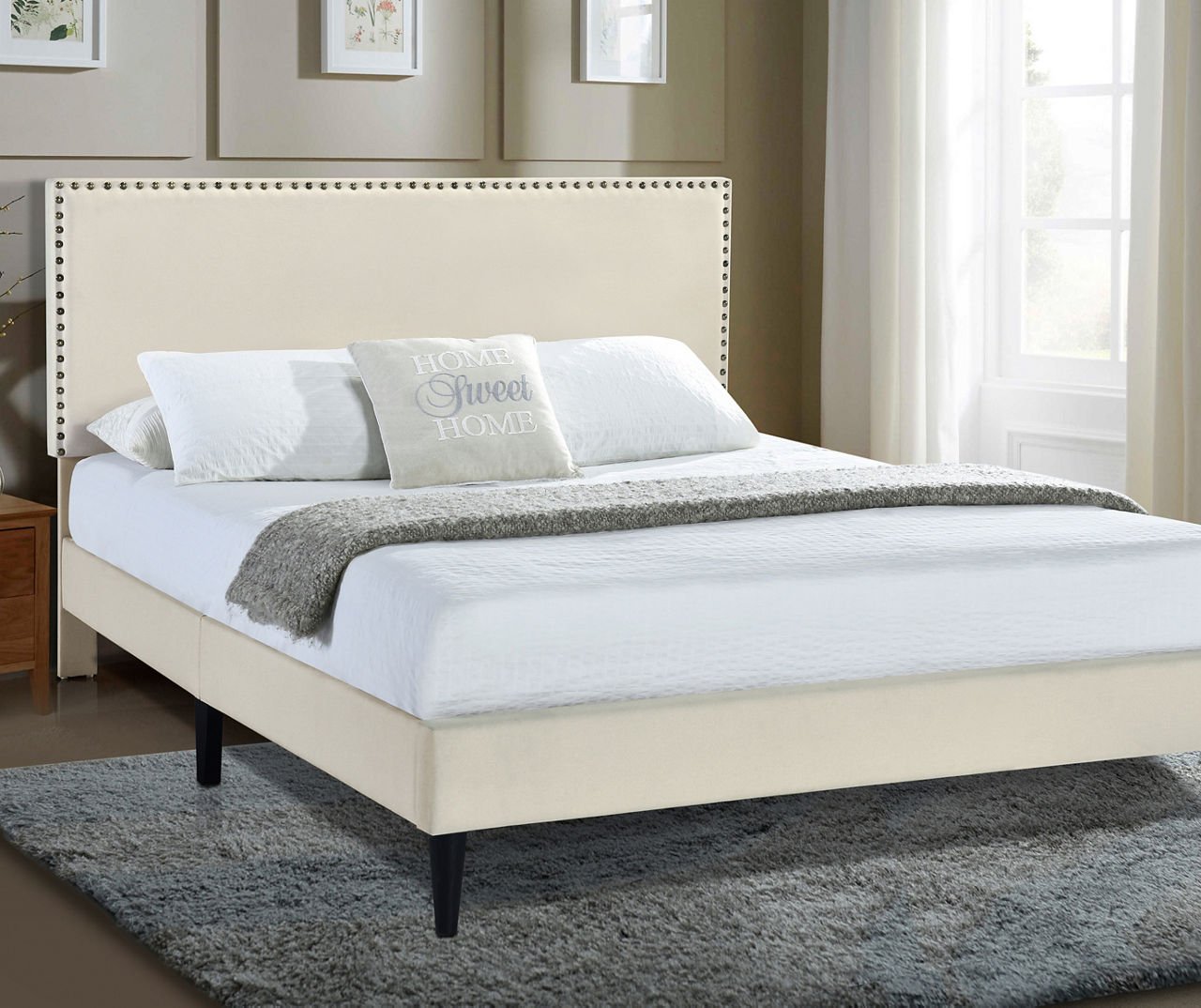 Upholstered bed deals with nailhead trim