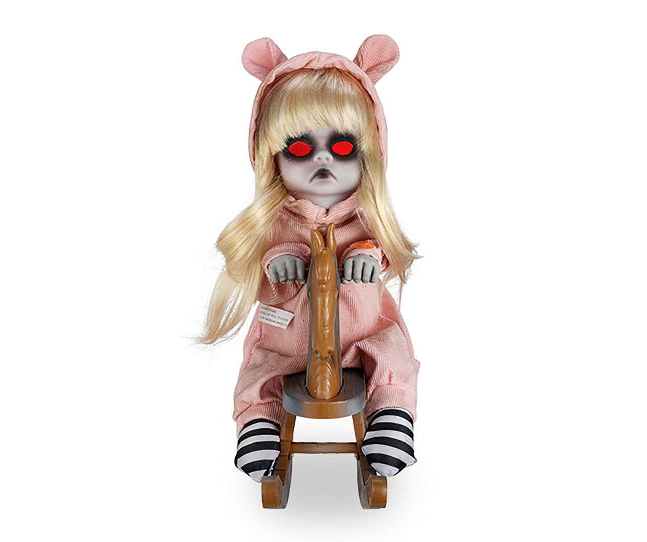 Halloween doll on store rocking horse